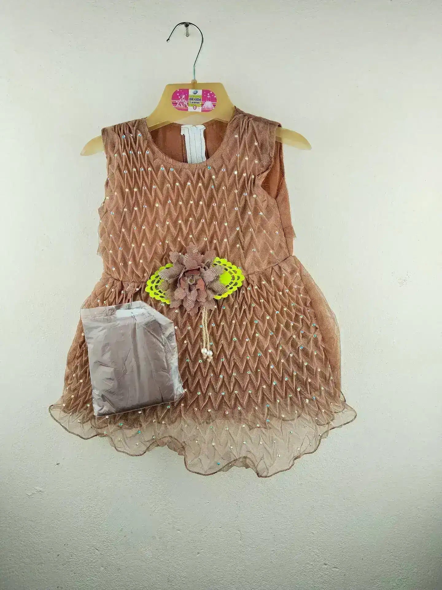 Blue Baby Party Dress with diamond-textured bodice, floral waist accent, and pearl ornament