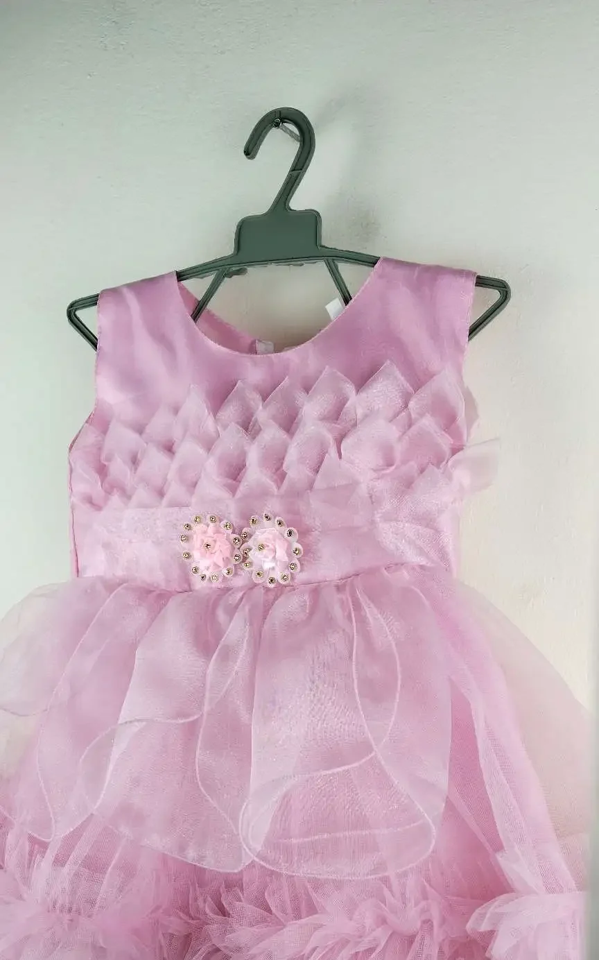 Light Pink Party Dress for Girls with floral top design, flower waist detail, and fluffy layered skirt for special occasions