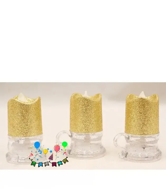 Glitter party mug candle with gold top, clear mug base, and festive birthday balloon graphics