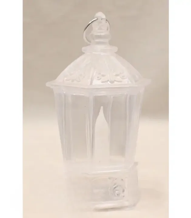 Translucent plastic party lantern with hexagonal shape, candle-style center, and hanging ring